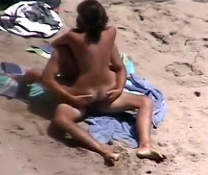 couples caught on beach
